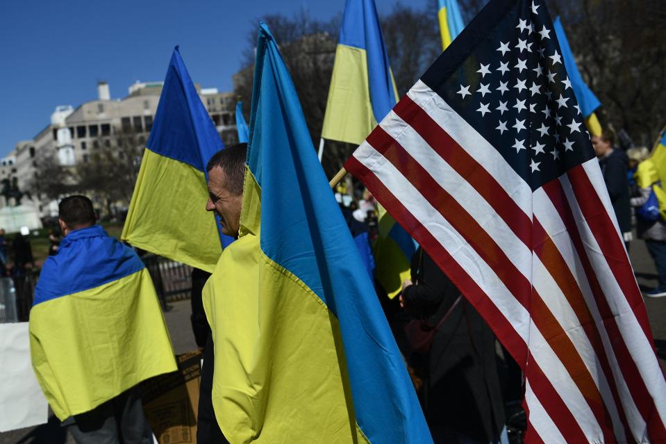 People protest against Russia's invasion of Ukraine during a rally across from the White House, in Washington, D.C.. on February 28, 2022.  / Credit: BRENDAN SMIALOWSKI/AFP via Getty Images