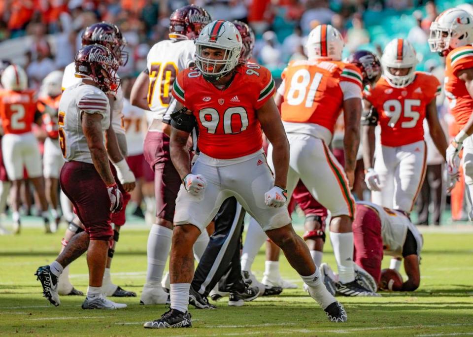 Miami Hurricanes defensive lineman Akheem Mesidor (90) reacts after tackling Bethune Cookman Wildcats quarterback Tyrone Franklin Jr (15) in the first half at Hard Rock Stadium in Miami Gardens on Saturday, September 3, 2022.