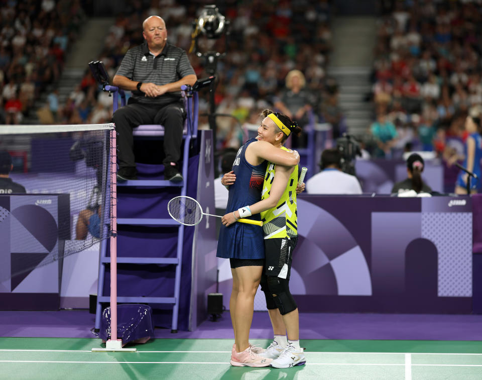 PARIS, FRANCE - JULY 31: Winner Ratchanok Intanon of Team Thailand (L) hugs Tzu Yin Tai of Team Chinese Taipei at the end of the Badminton Women's Singles Group Play Stage match on day five of the Olympic Games Paris 2024 at Porte de La Chapelle Arena on July 31, 2024 in Paris, France. (Photo by Lintao Zhang/Getty Images)