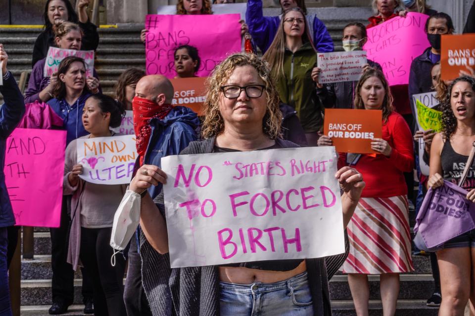 Supporters of abortion rights and anti-abortion rights gather for a protest at the Indiana Federal Courthouse on Tuesday, May 3, 2022, in Indianapolis.