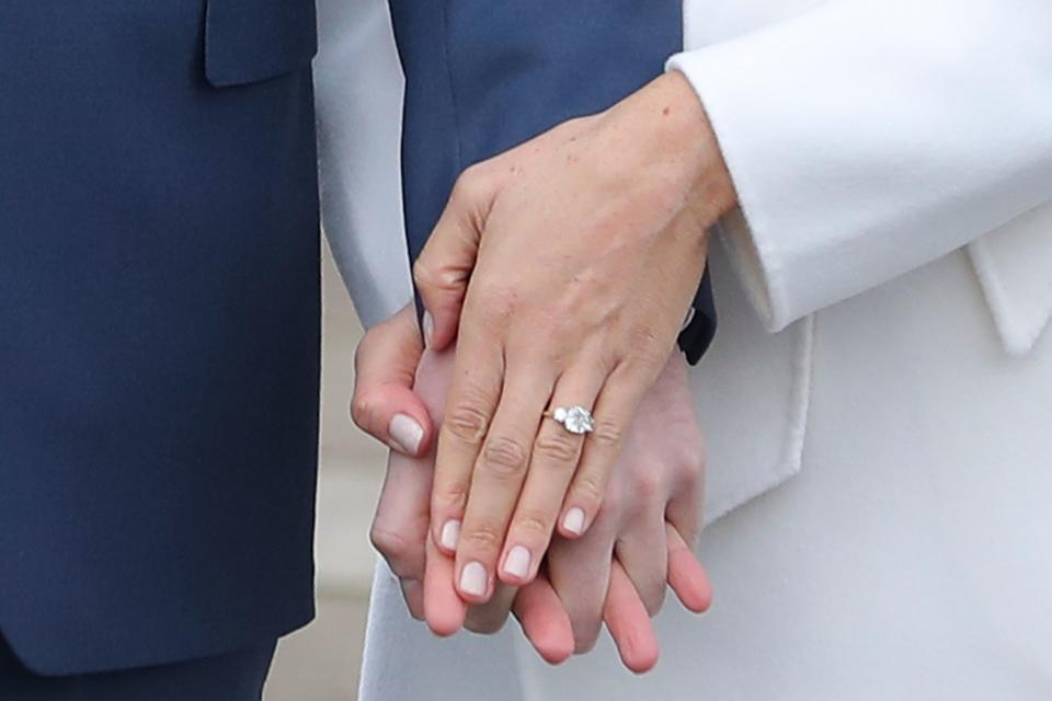 The Duchess of Sussex’s engagement ring from Prince Harry features a centre stone from Botswana which is flanked by two diamonds from Princess Diana’s private collection. Photo: Getty Images