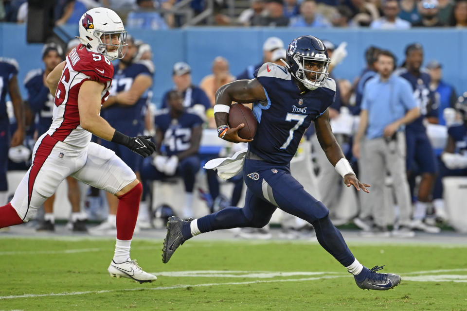 Tennessee Titans quarterback Malik Willis (7) scrambles past Arizona Cardinals linebacker Ben Niemann (56) in the first half of a preseason NFL football game Saturday, Aug. 27, 2022, in Nashville, Tenn. (AP Photo/Mark Zaleski)