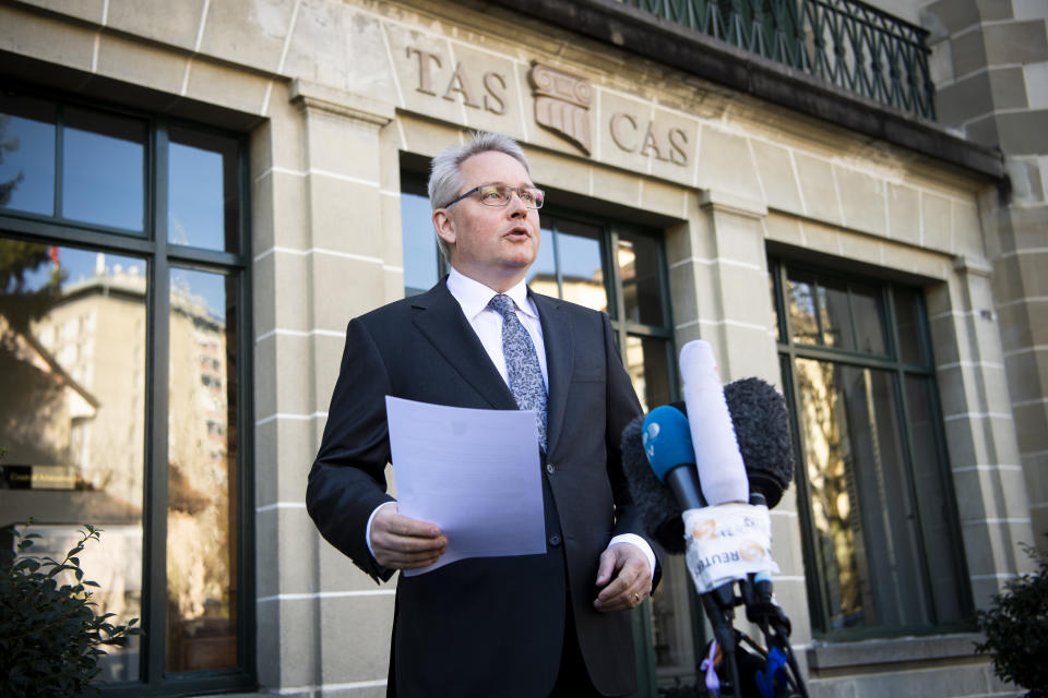 Matthieu Reeb, General Secretary of the Court of Arbitration for Sport, CAS, speaks to journalists during a statement as he announces the decision taken in the arbitration procedure of the case of Chinese swimmer Sun Yang in front of the Court of Arbitration for Sport (CAS) in Lausanne, Switzerland, Friday, Feb. 28, 2020. (Jean-Christophe Bott/Keystone via AP)