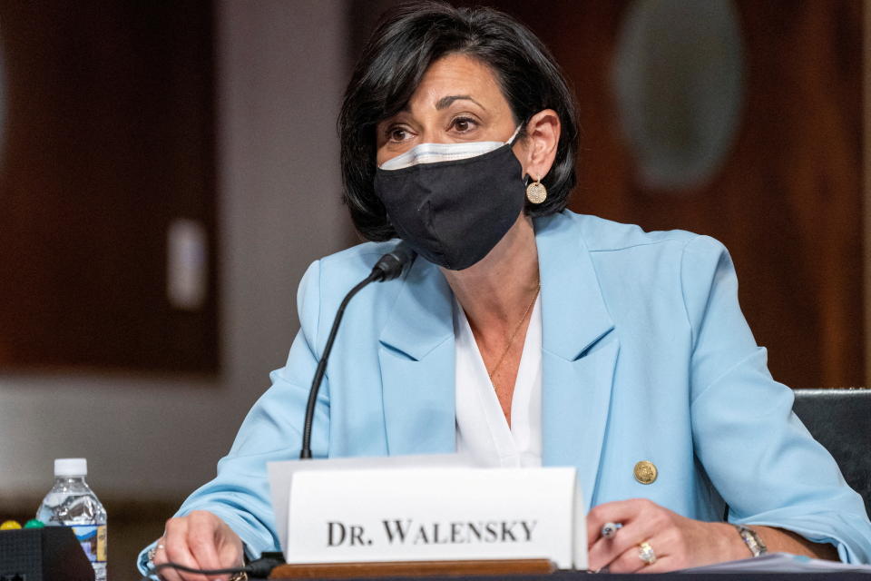 Dr. Rochelle Walensky, director of the Centers for Disease Control and Prevention, sits at a microphone during a Senate hearing.