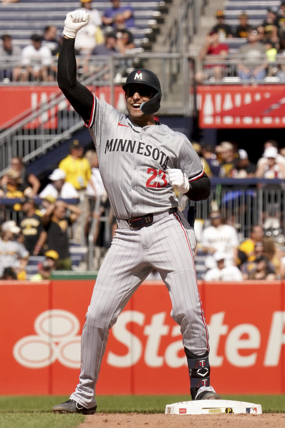 Minnesota Twins' Royce Lewis celebrates after hitting a ground rule double during the ninth inning of a baseball game against the Pittsburgh Pirates Sunday, June 9, 2024, in Pittsburgh. (AP Photo/Matt Freed)