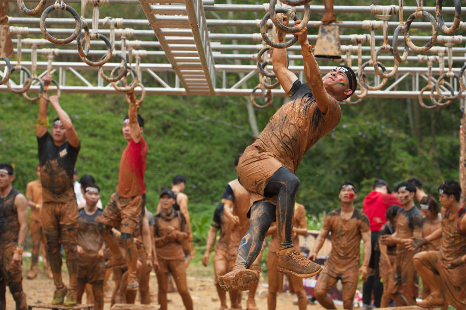 SHENZHEN, CHINA - MARCH 24:  Participants compete in the Spartan Race Shenzhen Sprint 2018 at Mission Hills Sports & Eco Park on March 24, 2018 in Shenzhen, Guangdong Province of China.  (Photo by Visual China Group via Getty Images/Visual China Group via Getty Images)