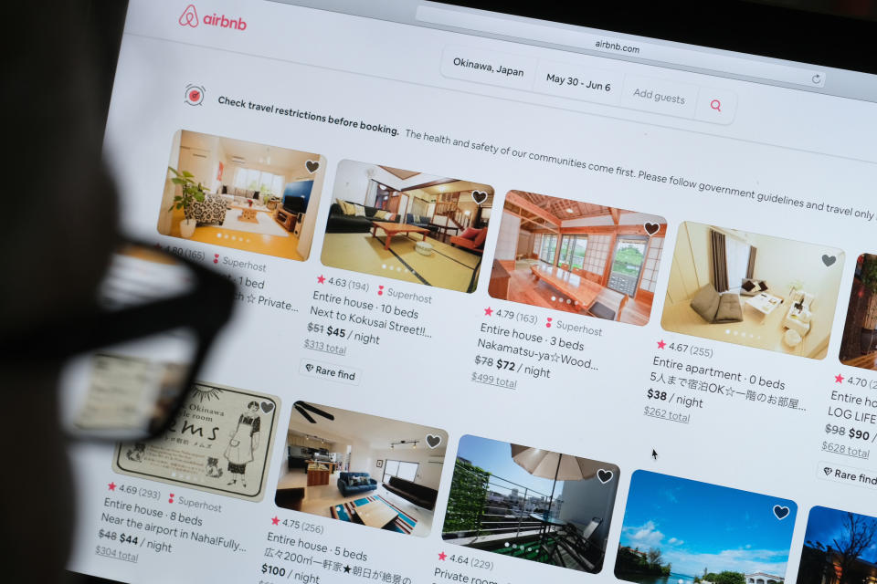 KATWIJK, NETHERLANDS - APRIL 20: In this photo illustration, a man looks at the website of Airbnb on April 20, 2020 in Katwijk, Netherlands.  (Photo by Yuriko Nakao/Getty Images)