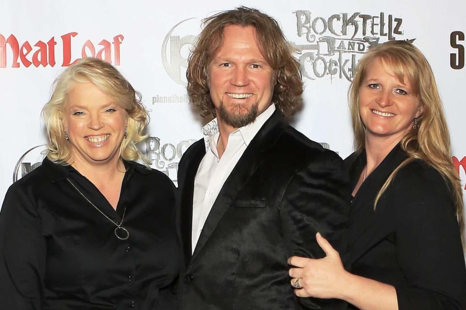 <p>Gabe Ginsberg/FilmMagic</p> (L-R) Janelle Brown, Kody Brown and Christine Brown are pictured at the show 