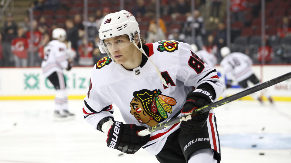 FILE - Chicago Blackhawks right wing Patrick Kane (88) skates during before an NHL hockey game against the New Jersey Devils, Tuesday, Dec. 6, 2022, in Newark, N.J. The New York Rangers have begun the machinations necessary if a trade for Patrick Kane were to materialize. They traded winger Vitali Kravtsov to the Vancouver Canucks and put forward Jake Leschyshyn on waivers on Saturday, Feb. 25, 2023. That could clear the cap space to get Kane from Chicago. (AP Photo/Noah K. Murray, File)