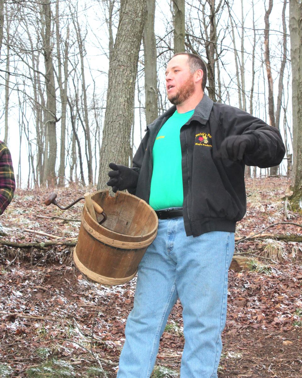 Matt Emerick, emcee for the tree tapping event and also owner of Emerick's Pure Maple in Southampton Township, speaks about how only in Somerset County are maple gathering buckets called "keelers."
