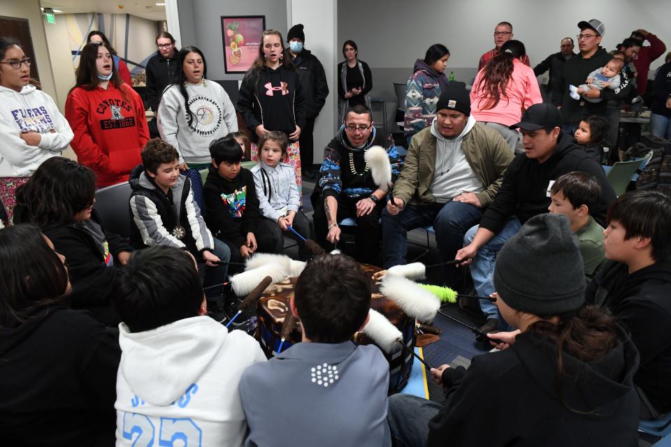 The Wakpa Ipaksan Singers, a youth music group from Flandreau, plays for visiting riders with the annual Dakota 38+2 Memorial Ride at Dakota State University during a stop on their journey across South Dakota and Minnesota on December 14, 2021 in Madison, SD.