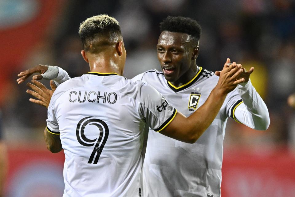 Jul 9, 2022; Chicago, Illinois, USA;  Columbus Crew SC forward Cucho (9) and midfielder Derrick Etienne (22) celebrate after defeating the Chicago Fire FC 3-2 at Soldier Field. Mandatory Credit: Jamie Sabau-USA TODAY Sports