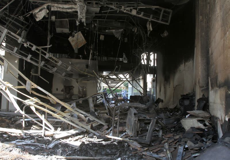 View of the damaged bank interior that was set ablaze during unrest overnight in Tripoli