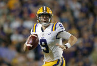 FILE - In this Nov. 30, 2019, file photo, LSU quarterback Joe Burrow (9) scrambles during the first half of an NCAA college football game against Texas A&M, in Baton Rouge, La. LSU quarterback Joe Burrow is The Associated Press college football player of the year in a landslide vote. Burrow, who has led the top-ranked Tigers to an unbeaten season and their first College Football Playoff appearance, received 50 of 53 first-place votes from AP Top 25 poll voters and a total of 156 points. (AP Photo/Gerald Herbert, File)