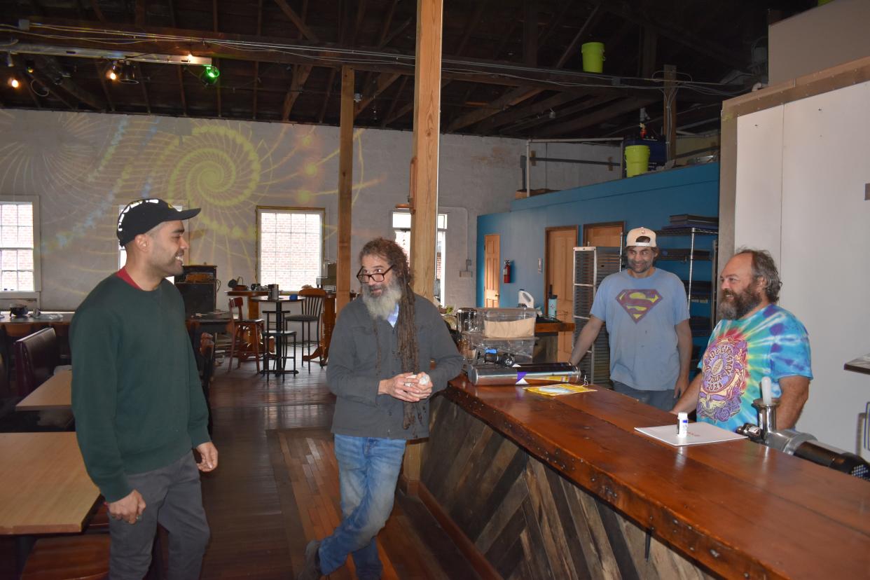 The CBD Cafe owner Peter Ford, second from left, is joined by general manager Ja Wall, right, Terpene Valley owner Umar Bryce, left, and John Baugh. The all-organic vegetarian restaurant is located at 38 Bailey's Branch Road in Marshall and will open soon.