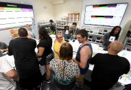 <p>Customers buy cannabis products at Essence Vegas Cannabis Dispensary after the start of recreational marijuana sales began on July 1, 2017 in Las Vegas, Nev. (Photo: Ethan Miller/Getty Images) </p>