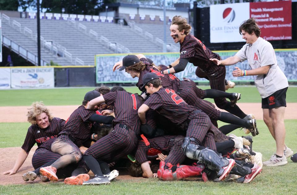 Milton players celebrate their championship at the conclusion of their game. Milton baseball versus King Philip in the MIAA D2 state championship game at Fitton Field in Worcester on Saturday, June 18, 2022. 