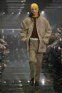 A model wears a creation part of the men's Prada Fall-Winter 2024-2025 collection, that was presented in Milan, Italy, Sunday, Jan. 14, 2024. (AP Photo/Luca Bruno).