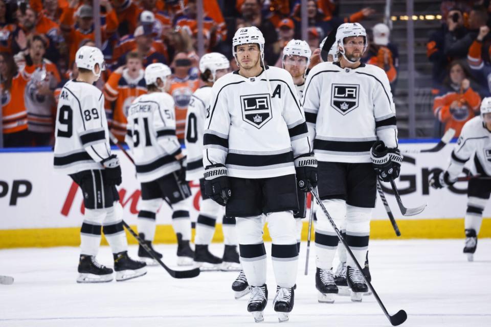 Dustin Brown, center, skates away after the final game of his career, May 14, 2022, in Edmonton, Alberta.