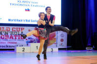 Katerina Tikhonova (L), daughter of Russian President Vladimir Putin, dances with Ivan Klimov during the World Cup Rock'n'Roll Acrobatic Competition in Krakow, Poland, April 12, 2014. REUTERS/Jakub Dabrowski/File Photo