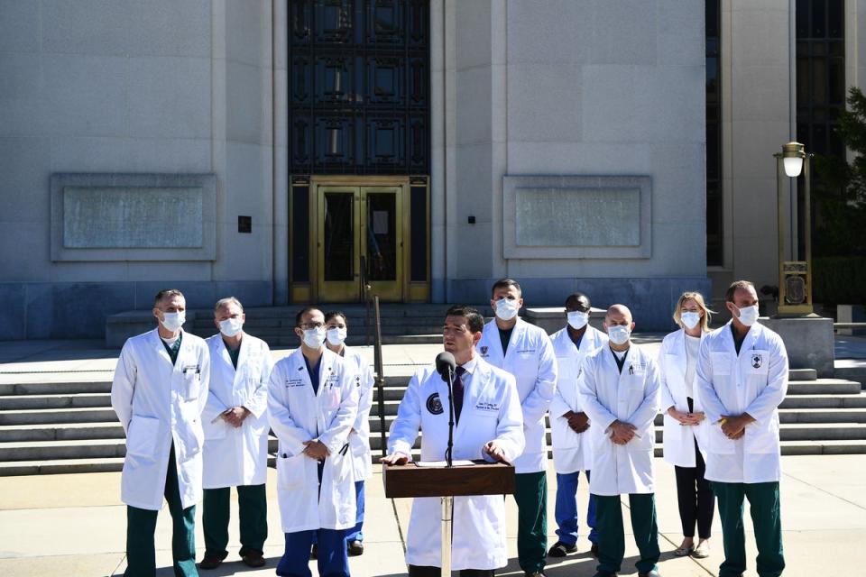 White House physician Sean Conley, with medical staff, gives an update on the condition of US President Donald Trump, on October 3, 2020, at Walter Reed Medical Center in Bethesda, Maryland (AFP via Getty Images)