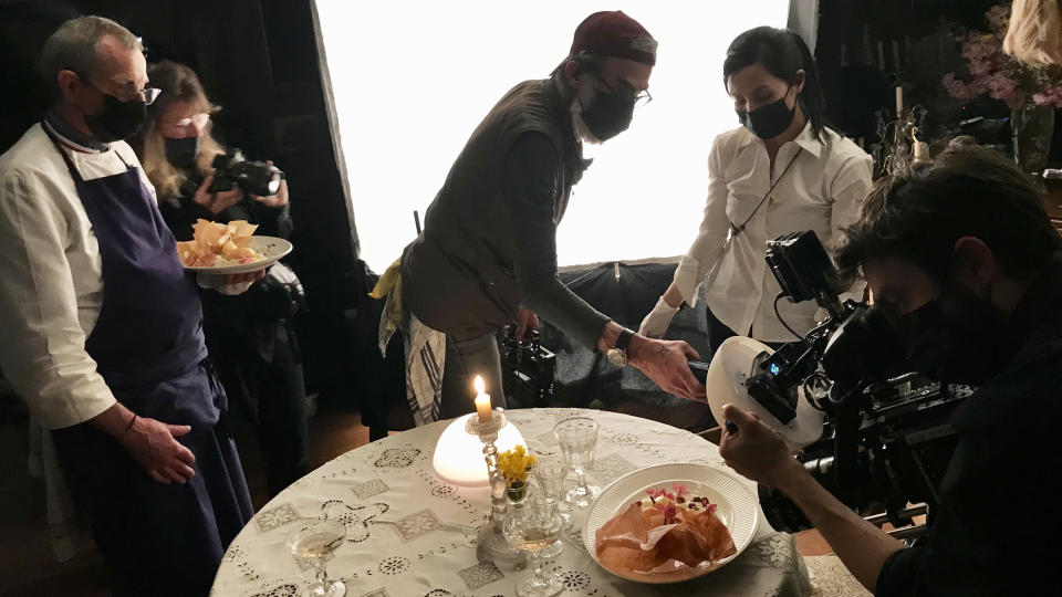 The “Taste of Things” crew films the pivotal poached pear fripé scene.
