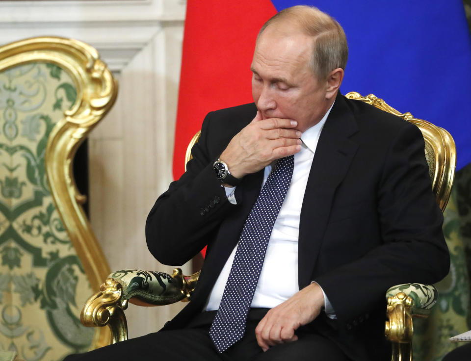 Russian President Vladimir Putin listens to Italian Prime Minister Giuseppe Conte during their meeting in the Kremlin in Moscow, Russia, Wednesday, Oct. 24, 2018. Italian Prime Minister Giuseppe Conte is holding talks with Russian officials on his first trip to Moscow. (Sergei Chirikov/Pool Photo via AP)