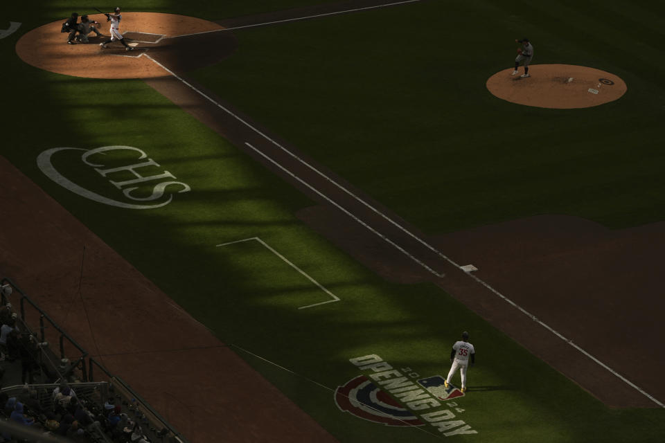 Minnesota Twins' Max Kepler, third from top left, swings at a pitch during the fifth inning of a baseball game against the Cleveland Guardians, Thursday, April 4, 2024, in Minneapolis. (AP Photo/Abbie Parr)