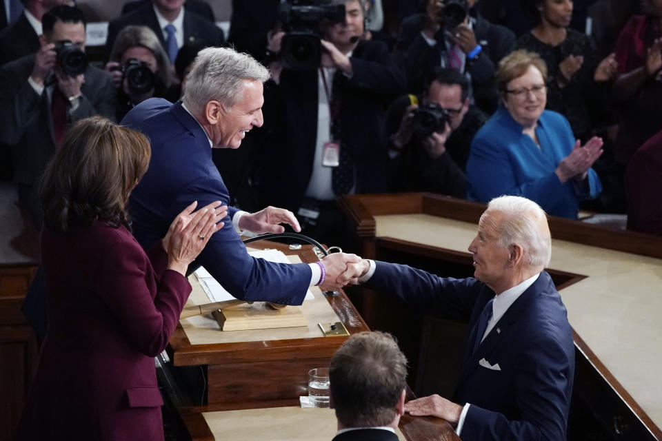 President Joe Biden arrives and shakes hands with House Speaker Kevin McCarthy of Calif., before he delivers his State of the Union speech to a joint session of Congress, at the Capitol in Washington, Tuesday, Feb. 7, 2023. (AP Photo/J. Scott Applewhite)