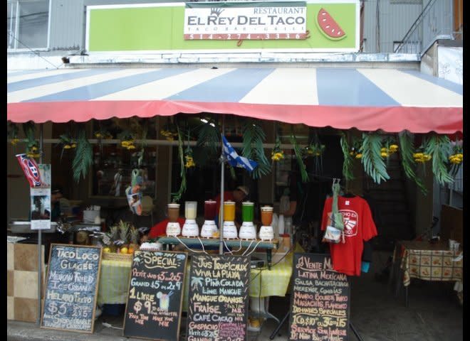 Agua fresca smoothies. Palm trees and tropical fruit drinks offer a taste of street food that is "Hecho en México" to visitors at the Jean Talon Market, Montreal, 2010. Operated by a chef from Querétaro, El Rey del Taco serves great mixiotes (pit-roasted lamb). 