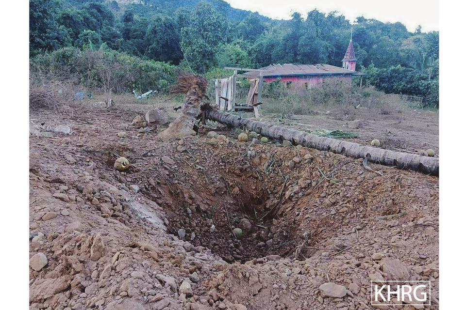 A crater is left by suspected military air strikes in the district of Mutraw, also known as Papun, in eastern Myanmar's Karen State, Friday, Jan. 13, 2023. Air strikes this week by Myanmar's military on villages inhabited largely by the Karen ethnic minority killed a number of civilians, and destroyed two churches, two relief organizations said Friday. (Karen Human Rights Group via AP)