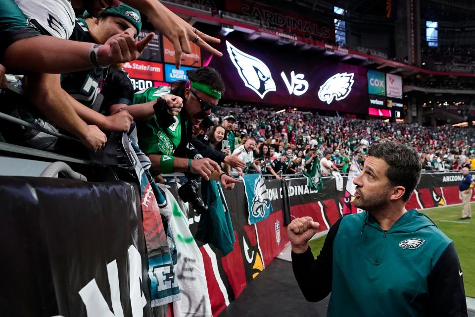 Philadelphia Eagles head coach Nick Sirianni, right, celebrates with fans after defeating the Arizona Cardinals on Oct. 9. (AP Photo/Ross D. Franklin)