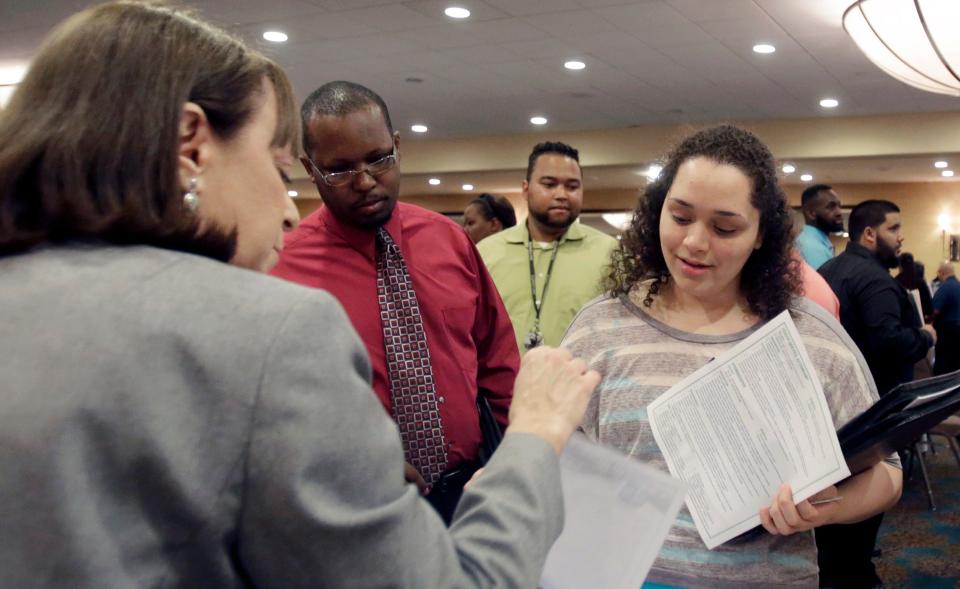 Activity at career fairs has been brisk as many Americans switch jobs.