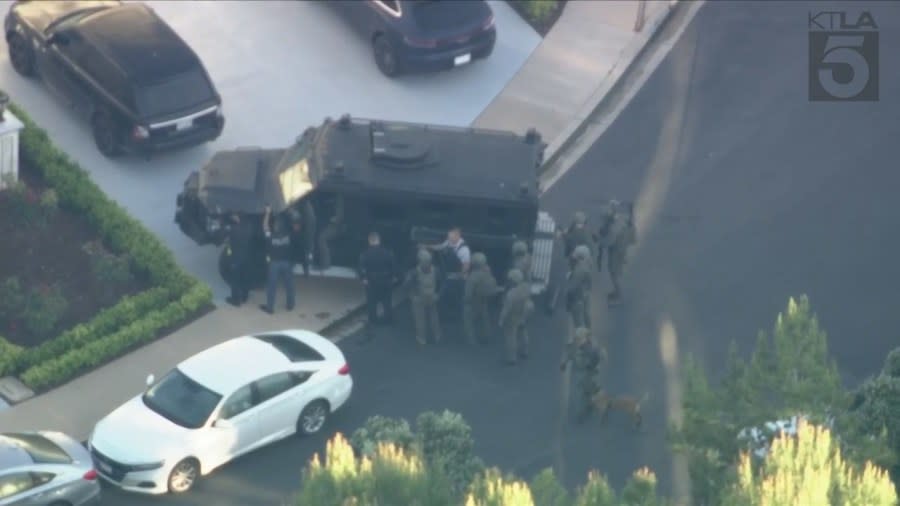 Law enforcement officials outside the scene of a possible home invasion in Newport Beach, CA on April 16, 2024. (Sky5)