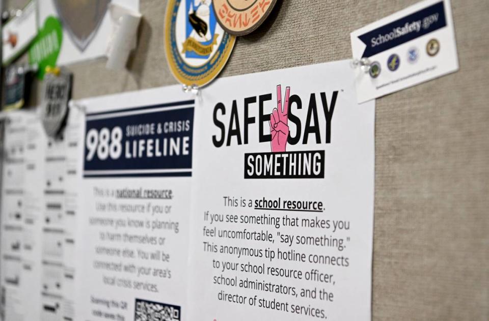 A flyer about Safe2Say hangs in school resource officer John Aston’s office at State College Area High School in May 2023.