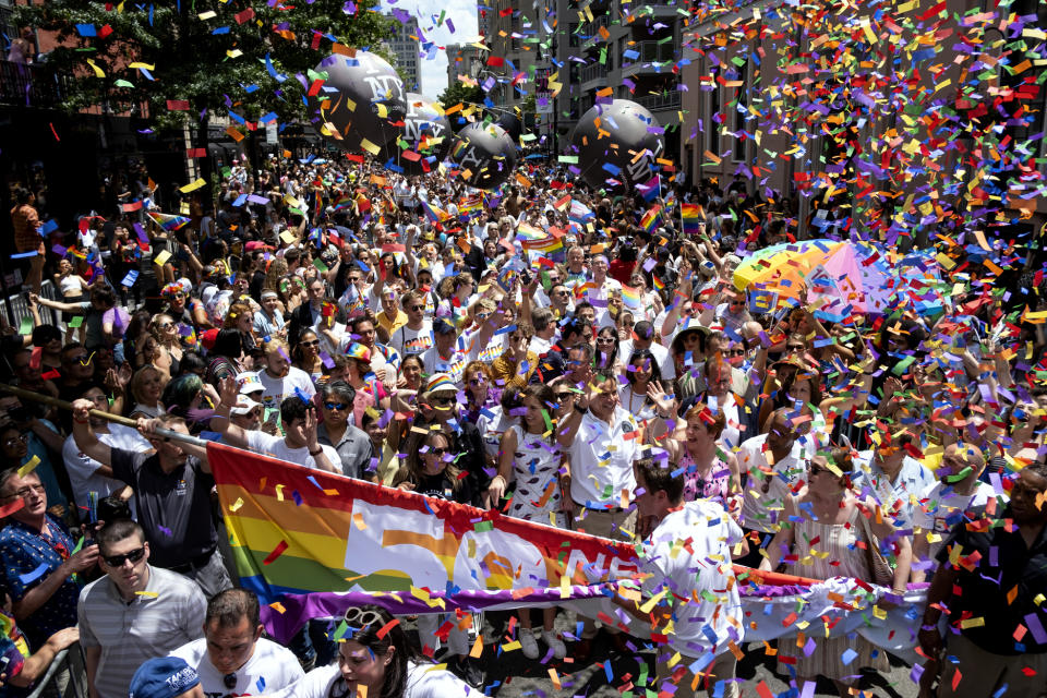 New York Governor Andrew Cuomo, lower front center, joins people participating in the LBGTQ Pride march Sunday, June 30, 2019, in New York. (AP Photo/Craig Ruttle)