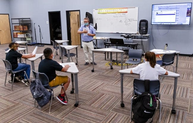 Mark Johnson works with students at Santa Fe South High School.