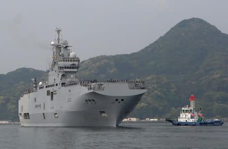 French amphibious assault ship Mistral (L) arrives at Japan Maritime Self-Defense Force's Sasebo naval base in Sasebo, Nagasaki prefecture, Japan April 29, 2017, ahead of joint exercises with U.S., British and Japanese forces in waters off Guam. REUTERS/Nobuhiro Kubo