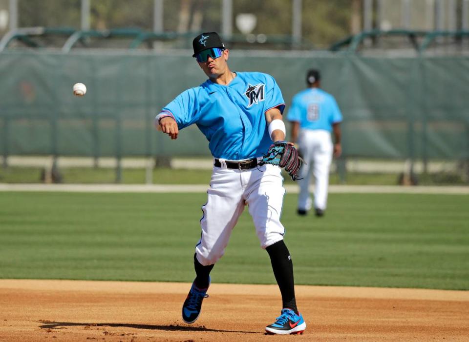 Miami Marlins shortstop Miguel Rojas (19) run drills during the first full-squad spring training workout at Roger Dean Stadium on Monday, February 17, 2020 in Jupiter, FL.