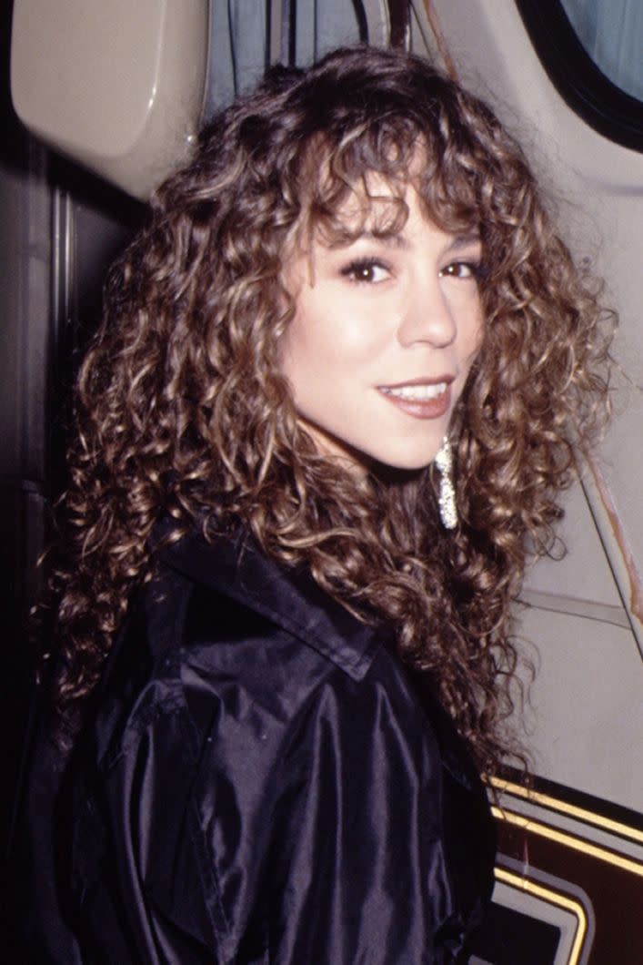 <p>Mariah grew up and kicked off her storied career with medium-brown curls.</p>