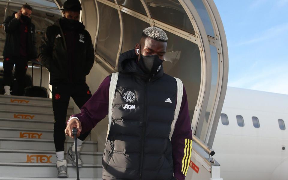 Paul Pogba arrives in Paris for the clash with PSG - GETTY IMAGES