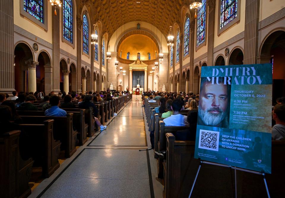 Faculty, students and guests listen as Russian journalist Dmitry Muratov speaks at College of the Holy Cross' St. Joseph Memorial Chapel.