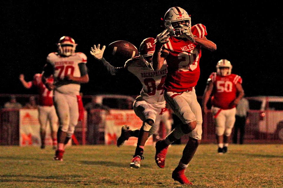 Keagan Riddle (20) tries to make a catch in the end zone for Miles during a game against Rocksprings on Friday, Oct. 29, 2021.
