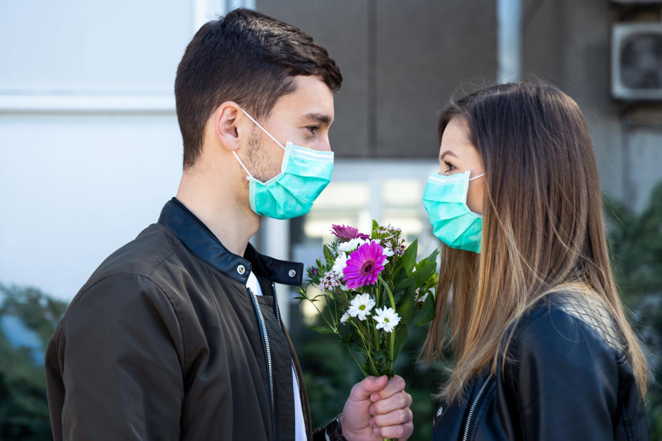 Couple wearing masks having good time together