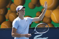 Jannik Sinner, of Italy, waves after defeating Roberto Bautista Agut, of Spain, during the semifinals of the Miami Open tennis tournament, Friday, April 2, 2021, in Miami Gardens, Fla. Sinner won 5-7, 6-4, 6-4. (AP Photo/Lynne Sladky)