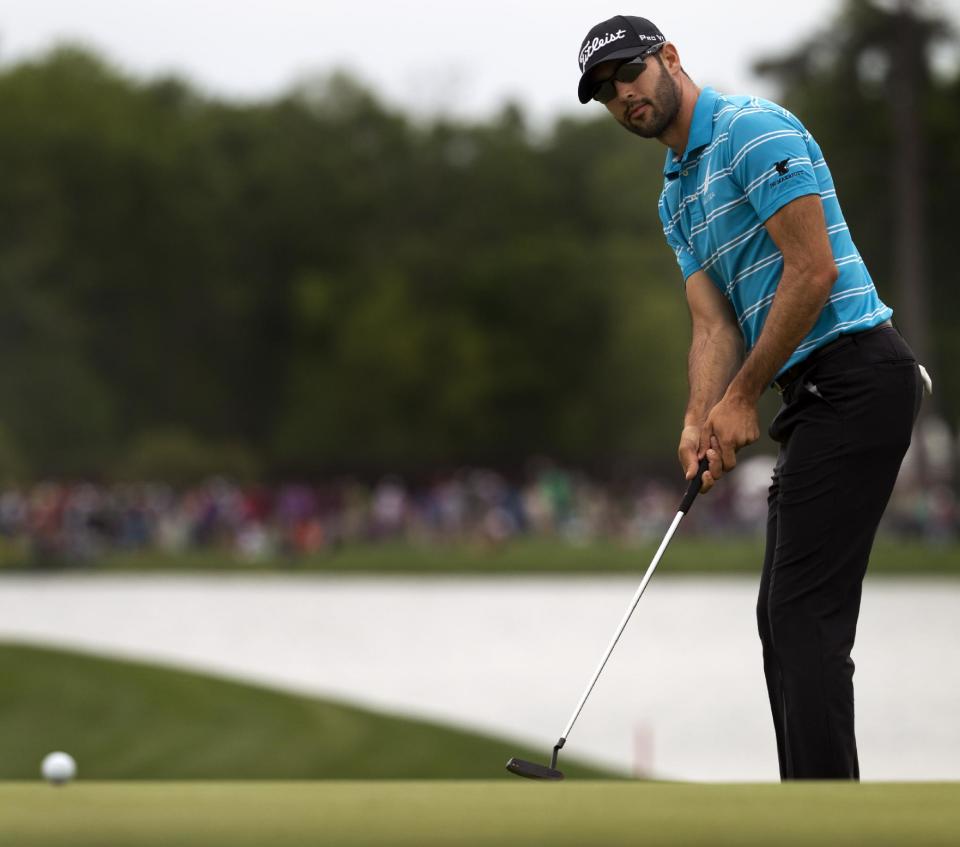 Cameron Tringale putts on the eighteenth green during the third round of the Houston Open golf tournament on Saturday, April 5, 2014, in Humble, Texas. (AP Photo/Patric Schneider)