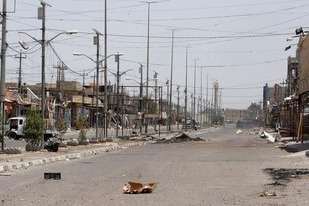 A view of a street is seen in Falluja, Iraq, after government forces recaptured the city from Islamic State militants, June 30, 2016. REUTERS/Ahmed Saad