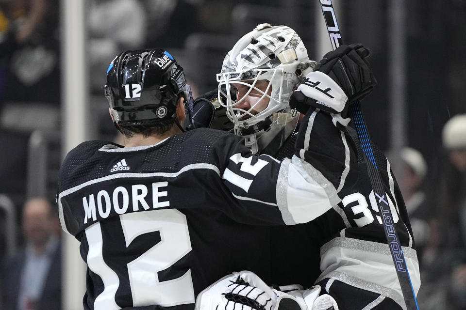 Los Angeles Kings left wing Trevor Moore, left, hugs goaltender Cam Talbot after the Kings defeated the Seattle Kraken 5-2 in an NHL hockey game Wednesday, April 3, 2024, in Los Angeles. (AP Photo/Mark J. Terrill)