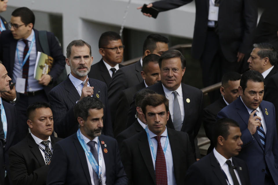 Spain's King Felipe, left center, Panama's President Juan Carlos Varela, center, and Guatemala's President Jimmy Morales arrive to an economic forum as part the XXVI Iberoamerican Summit in Antigua, Guatemala, Thursday, Nov. 15, 2018. The event is a biennial two-day meeting of heads of state from Latin America and the Iberian Peninsula. (AP Photo/Moises Castillo)