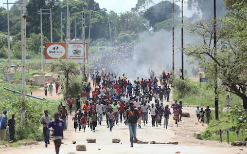  Jan. 14, 2019 file photo, protestors gather on the streets during demonstrations over the hike in fuel prices in Harare - Credit: Tsvangirayi Mukwazhi/&nbsp;AP